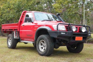 Front left side view of a Nissan Patrol GU Ute after being fitted with a 2 Inch Bilstein and Airbag Man Airbag Lift Kit