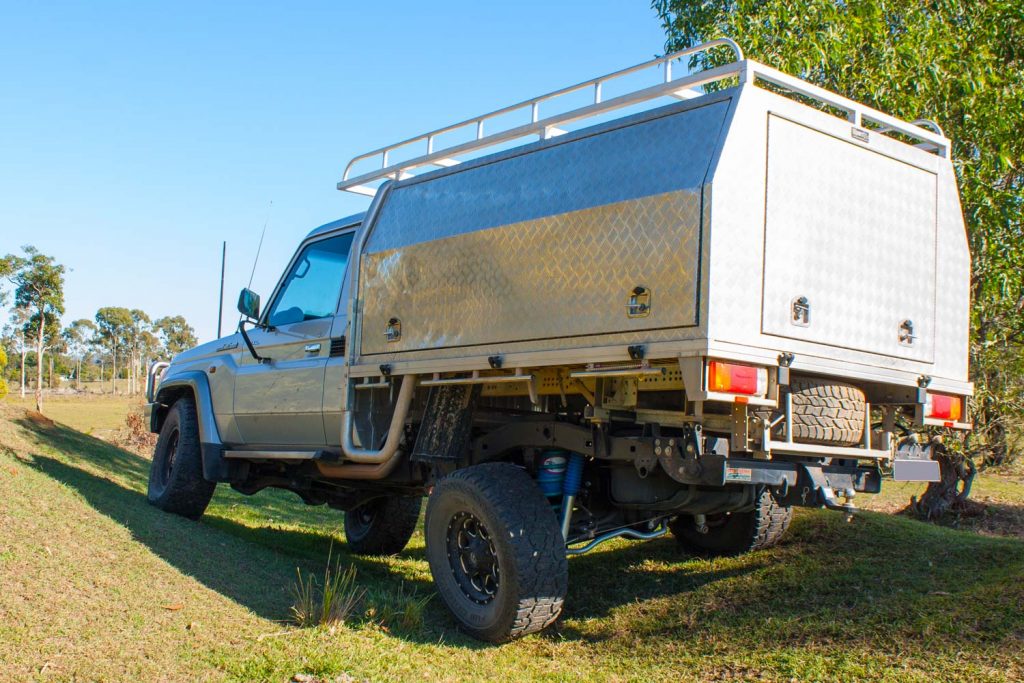 Rear left end flex of a Silver Single Cab 79 Series Toyota Landcruiser fitted with a heavy duty rear coil conversion kit