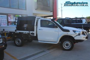 Right side view of a Toyota Hilux Revo (single cab) fitted with a 2 inch Airbag Man leaf spring helper kit and Dual air control kit