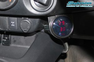 Closeup view of the Airbag Man digital gauge fitted to a single cab Toyota Hilux Revo showing the psi of the airbags