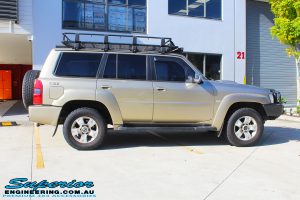 Side view of a Gold Nissan GU Patrol Wagon before fitting a 2" inch lift with Dobinsons Coil Springs & Fox Shocks