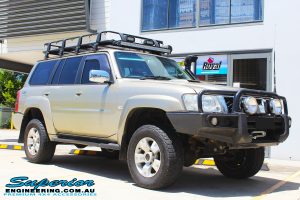 Right front side view of a Gold Nissan GU Patrol Wagon after fitting a 2" inch lift with Dobinsons Coil Springs & Fox Shocks