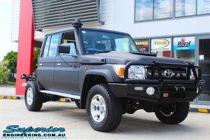Right front side view of a Black Toyota 79 Series Landcruiser Dual Cab before fitting a Superior Remote Reservoir 2" Inch Lift Kit with Airbag Man Leaf Air Kit