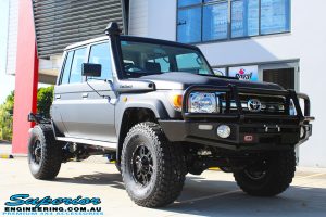 Right front side view of a Black Toyota 79 Series Landcruiser Dual Cab after fitting a Superior Remote Reservoir 2" Inch Lift Kit with Airbag Man Leaf Air Kit