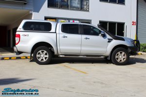 Right side view of a Silver Ford PX Ranger before fitment of a Bilstein 2" Inch Lift Kit + Airbag Man Leaf Air Kit