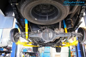 Rear underbody view of the fitted Bilstein Shocks + EFS Leaf Springs and Airbag Man Leaf Air Kit