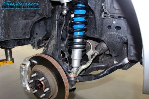 Front right inside guard view of the fitted Nitro Gas Front Strut, Coil Spring + Adjustable Upper Control Arms