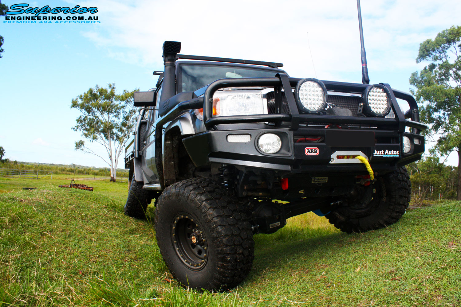 Front on view of a Grey Toyota 79 Series Landcruiser Dual Cab after fitment of a Superior 4" Inch Rear Coil Conversion Kit with Hyperflex Radius Arms.