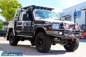 Right front side view of a Grey Toyota 79 Series Landcruiser Dual Cab after fitment of a Superior 3" Inch Nitro Gas Lift Kit, Airbag Man Digital Dual Air Control Kit w/Tyre Inflation & Leaf 3" Inch Air Lift Kit