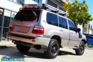 Rear right view of a Silver Toyota 100 Series Landcruiser after fitment of a 2" Inch Lift Kit with Airbags