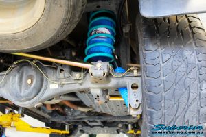 Rear right underbody shot showing the fitted Superior Remote Reservoir Shock Absorber, Coil Spring, Superior Rear Panhard Rod & Airbag Man Coil Air Helper Kit