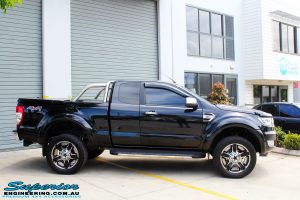 Right side view of a Ford PXII Ranger in Black after fitment of a Superior 2" Inch Remote Reservoir Lift Kit + Airbag Man Leaf Air Kit
