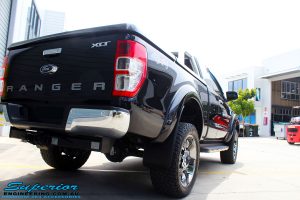 Rear right view of a Ford PXII Ranger in Black after fitment of a Superior 2" Inch Remote Reservoir Lift Kit + Airbag Man Leaf Air Kit