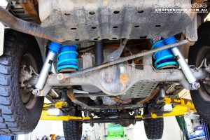 Rear mid underbody shot of the fitted Superior 2" Nitro Gas Shocks with Coil Springs