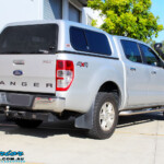 Rear right view of a Silver Ford PX Ranger before fitment of a Bilstein 2" Inch Lift Kit + Airbag Man Leaf Air Kit