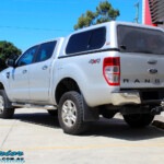 Rear left view of a Silver Ford PX Ranger after fitment of a Bilstein 2" Inch Lift Kit + Airbag Man Leaf Air Kit