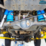 Rear underbody view of both fitted 2" Nitro Gas Shocks with Coil Tower Brace Kit, Airbag Man Coil Air Helper Kit and Coil Springs