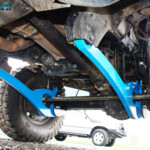 Front underbody view of the fitted Hyperflex Radius Arms on the 79 Series.