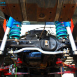 Rear underbody view looking forward on the fitted Superior 2" Inch Rear Coil Conversion Kit