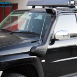Right side close up shot of a Black Nissan GU Patrol Wagon after being fitted with a Safari Snorkel