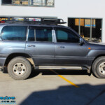 Right side view of a Silver Toyota 100 Series Landcruiser before fitment of a 2" Inch Lift Kit with Airbags