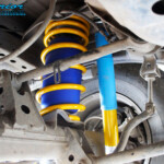 Rear left underbody inside view of the fitted Bilstein Shock, King Coil Spring + Airbag