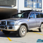 Left front side view of a Silver Toyota 100 Series Landcruiser after fitment of a 2" Inch Lift Kit with Airbags