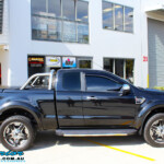 Right side view of a Ford PXII Ranger in Black before fitment of a Superior 2" Inch Remote Reservoir Lift Kit + Airbag Man Leaf Air Kit