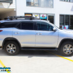 Right side view of a Toyota Fortuner Wagon in Silver before fitment of a Fox 2.0 Performance Series IFP 2" Inch Lift Kit with Airbag Man Coil Helper Air Kit